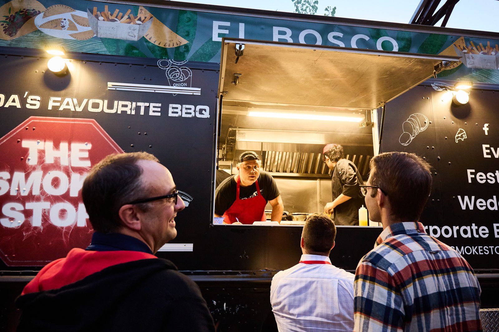 Close-up of the El Bosco and Smoke Stop food truck signage