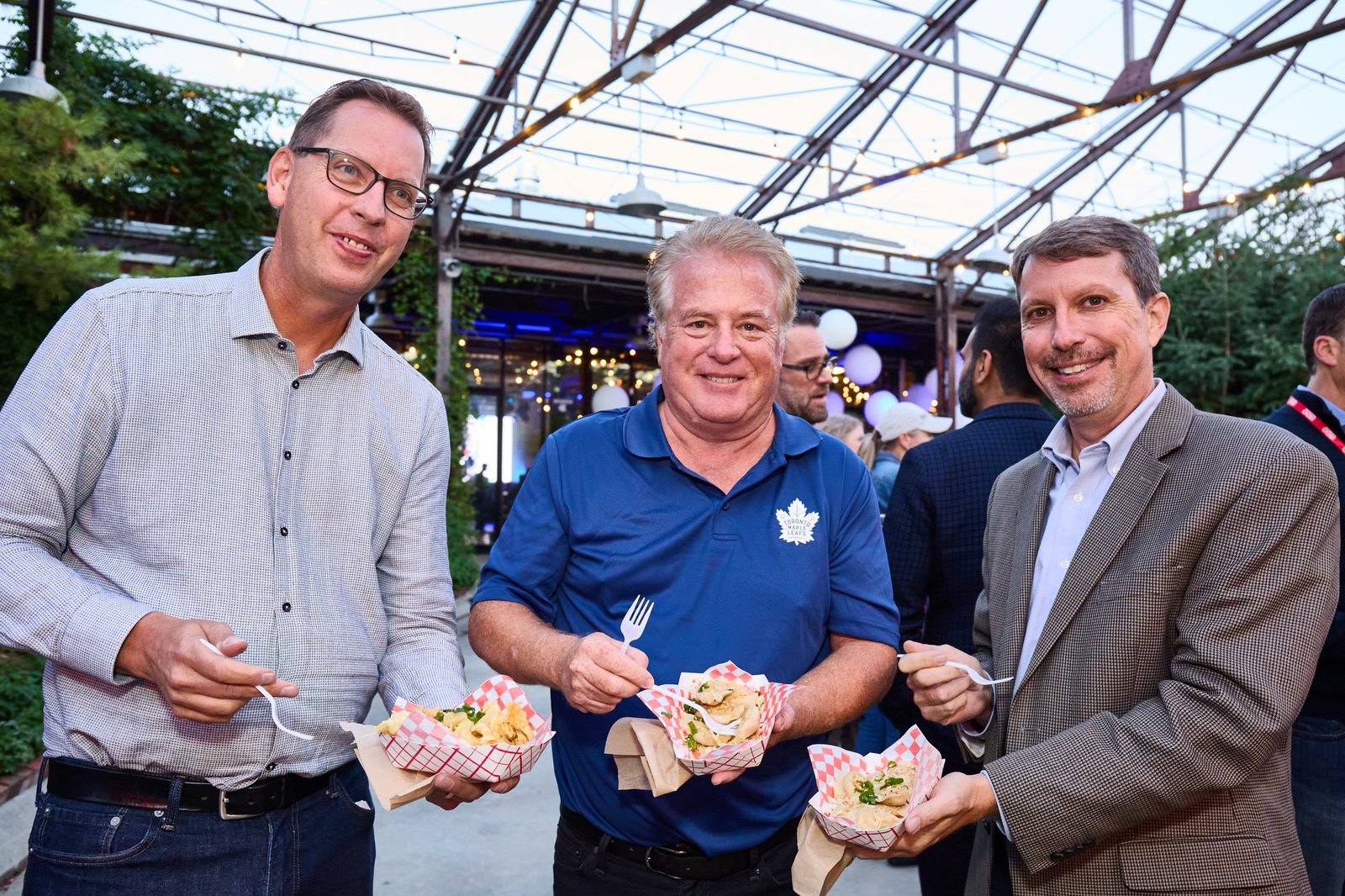 Guests enjoying food truck fare under the Evergreen Brickworks roof