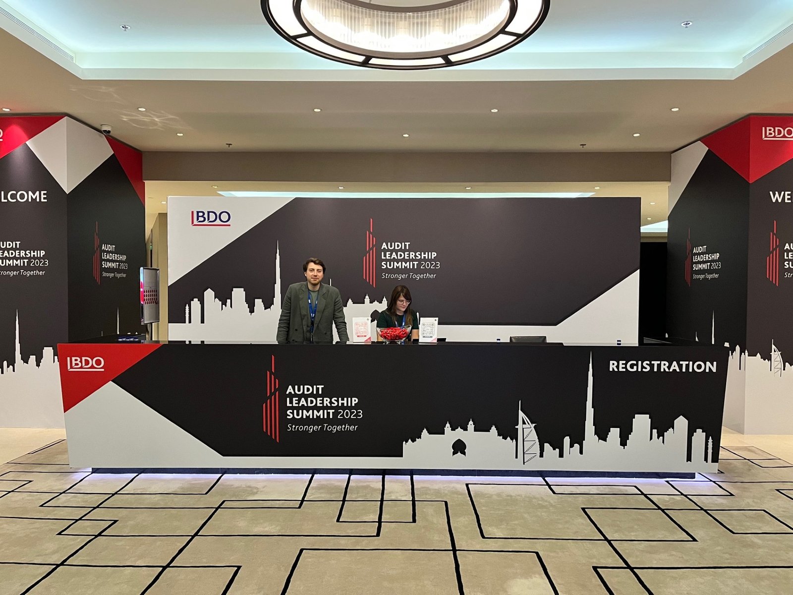 Registration desk branded for the Audit Leadership Summit 2023
