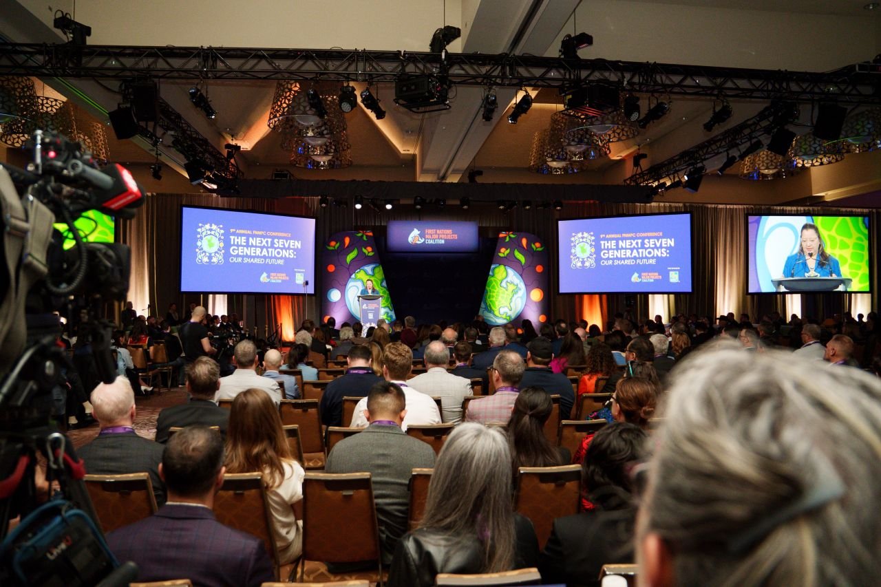 Wide view of the conference hall during a keynote session