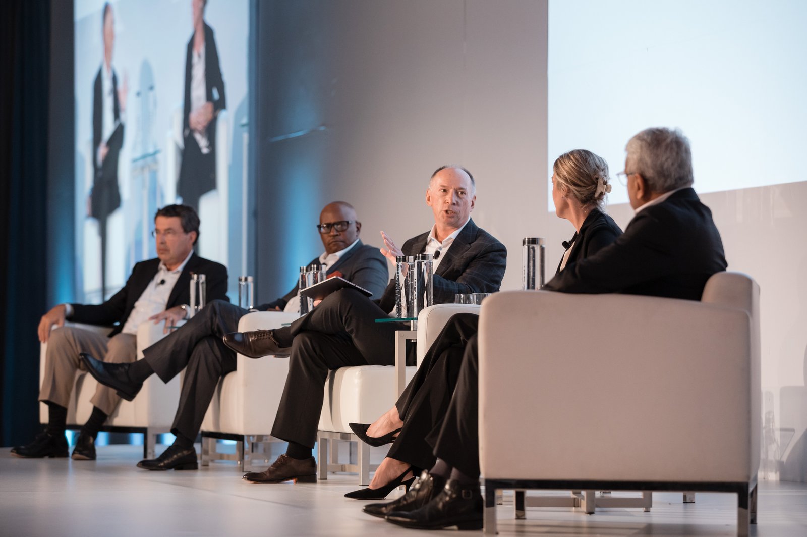 Panelists in conversation on stage