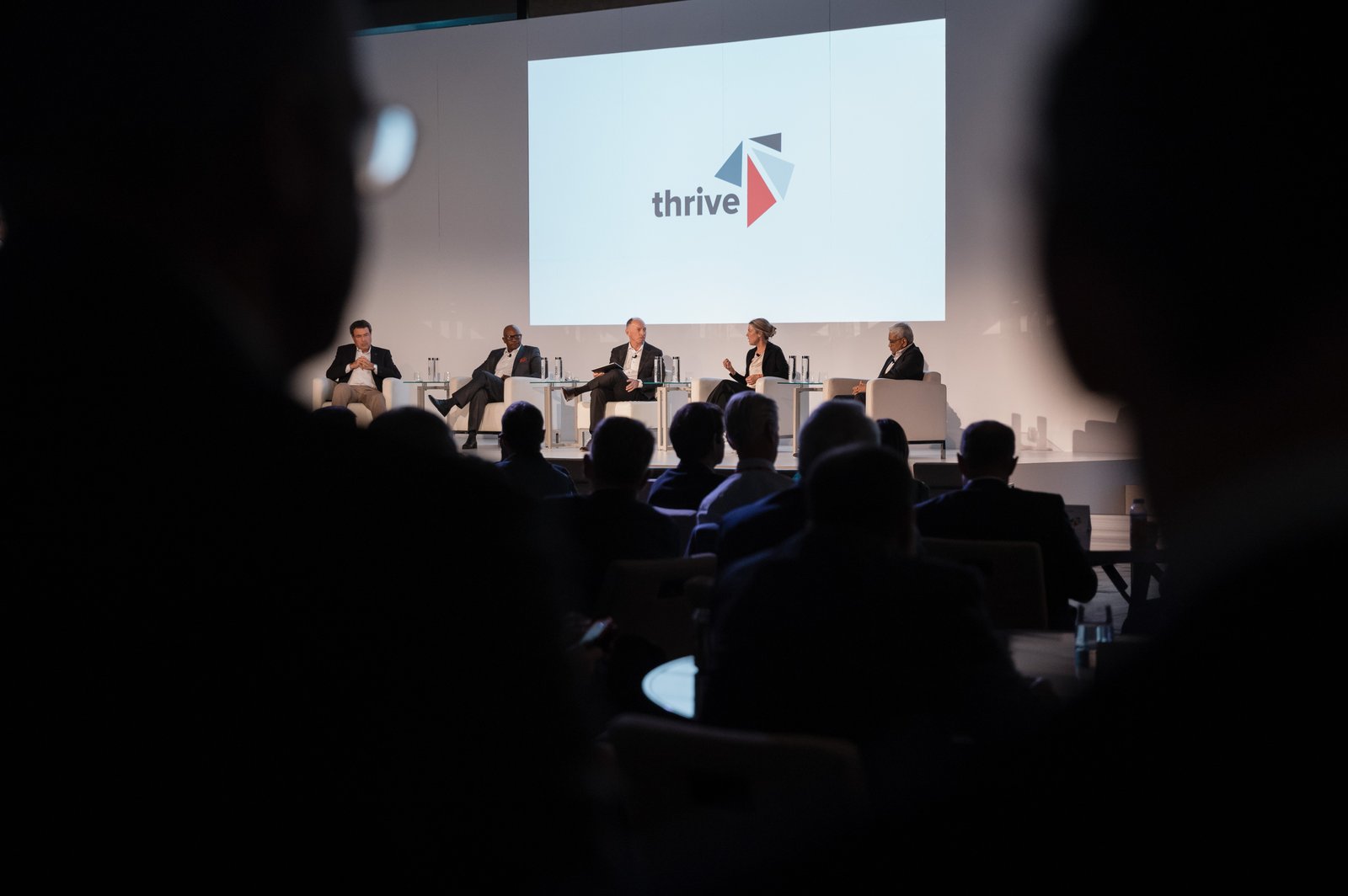 Screen displaying the Thrive conference branding